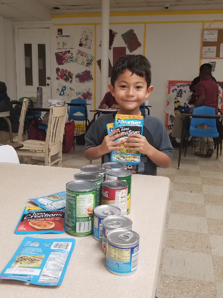 Child participating in food drive
