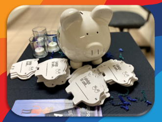 Piggy bank on a table with pledge forms for saving