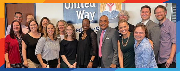 Members of the United Way Suncoast team gathered together with smiles
